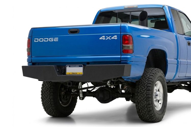 Aftermarket rear bumper for Dodge Ram 2500/3500 (2001 and newer), heavy‑duty steel design built for durability, towing strength, and rugged off‑road protection.