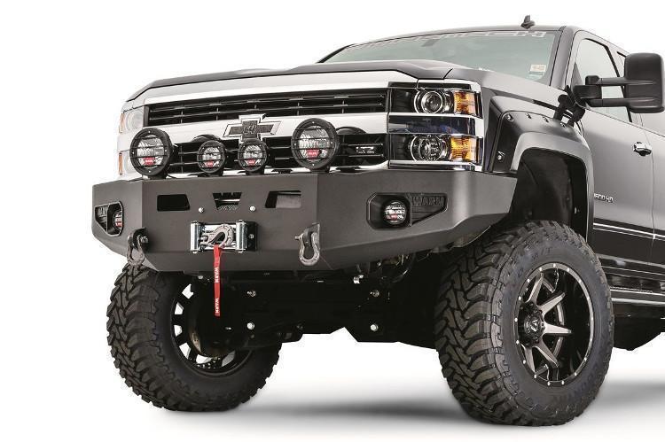 Warn front bumper on Chevy Silverado 1500 – heavy-duty off-road bumper with winch mount and grille guard for maximum protection and utility.