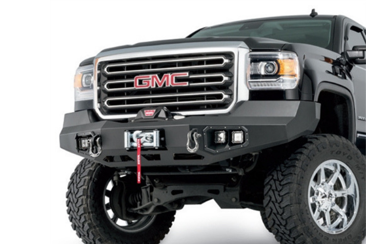 Off-road ready Warn front bumper for GMC Sierra 1500, designed for maximum durability