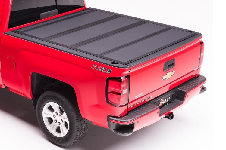 Durable truck bed with a sleek, low-profile tonneau cover installed for weather protection and cargo security