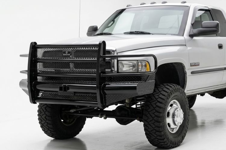 Ranch Hand heavy duty black steel front bumper with full grille guard protector mounted on a 1994-2002 Dodge Ram 2500 heavy duty truck.