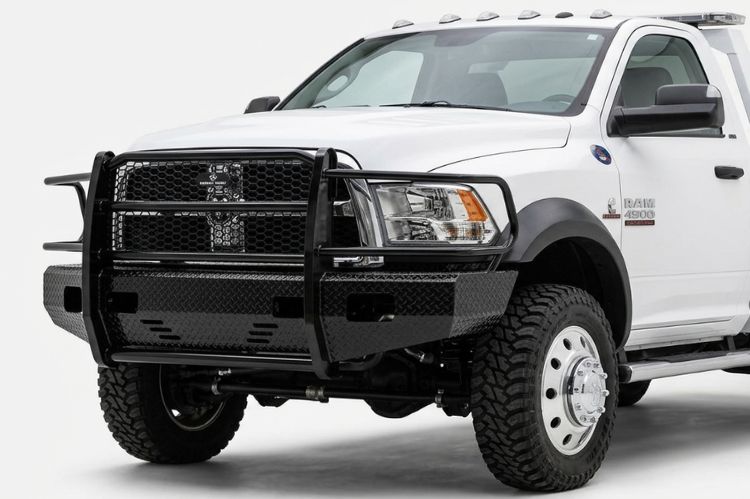 Ranch Hand Legend Series commercial replacement bumper featuring a diamond plate steel finish and heavy duty brush guard on a Ram 4500 work truck.