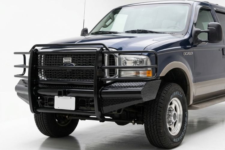 Heavy-duty Ranch Hand Legend front bumper with full grille guard installed on a Ford Excursion.