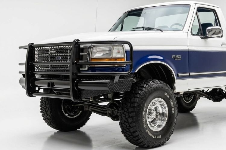 Ranch Hand Legend front bumper with full grille guard installed on a 1995 Ford F150.