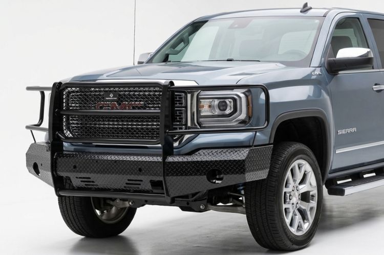 Gloss black Ranch Hand Summit front bumper with full grille guard wrap on a dark green 2014 GMC Sierra 1500.