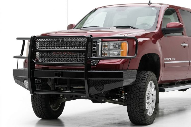 Matte black Ranch Hand Sport front bumper with integrated winch mount on a 2012 GMC Sierra 3500 dually.