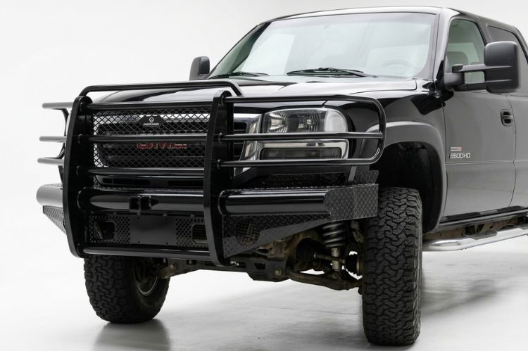 Gloss black Ranch Hand Legend front replacement bumper with full wraparound grille guard on a 2005 GMC Sierra heavy duty truck.