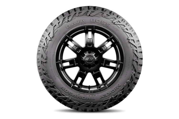 All-terrain truck tires with rugged alloy wheels designed for off-road performance and durability