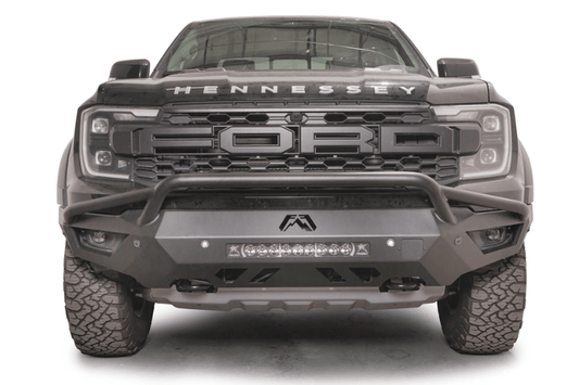 Fab Fours FR24-D6452-1 Vengeance Front Bumper with Pre-runner Guard installed on a 2024 Ford Ranger Raptor, featuring a high and tight fit, 11-gauge U.S. steel construction, matte black powder coat finish, and integrated mounts for a 20-inch LED light bar and dual cube lights.