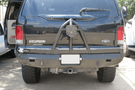Road Armor Stealth 61208B rear bumper replacement with spare tire carrier for 1999-2007 Ford Excursion – heavy-duty back bumper with rear winch mount, textured black finish, winch-ready design