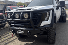 Road Armor Stealth 2242F2B Front Bumper with Titan II Guard installed on a 2024 GMC Sierra 2500 HD, featuring textured black finish, winch compatibility, and aggressive off-road styling.