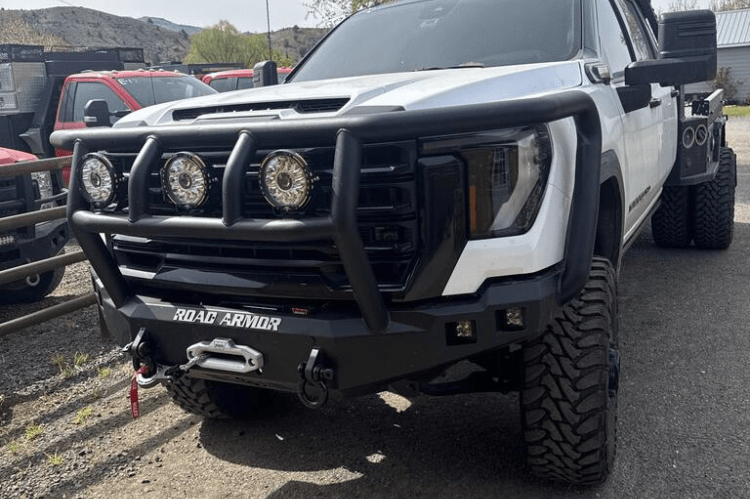 Road Armor Stealth 2242F2B Front Bumper with Titan II Guard installed on a 2024 GMC Sierra 2500 HD, featuring textured black finish, winch compatibility, and aggressive off-road styling.
