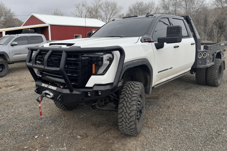 Road Armor Stealth 2242F2B Front Bumper with Titan II Guard installed on a 2024 GMC Sierra 2500 HD, featuring textured black finish, winch compatibility, and aggressive off-road styling.