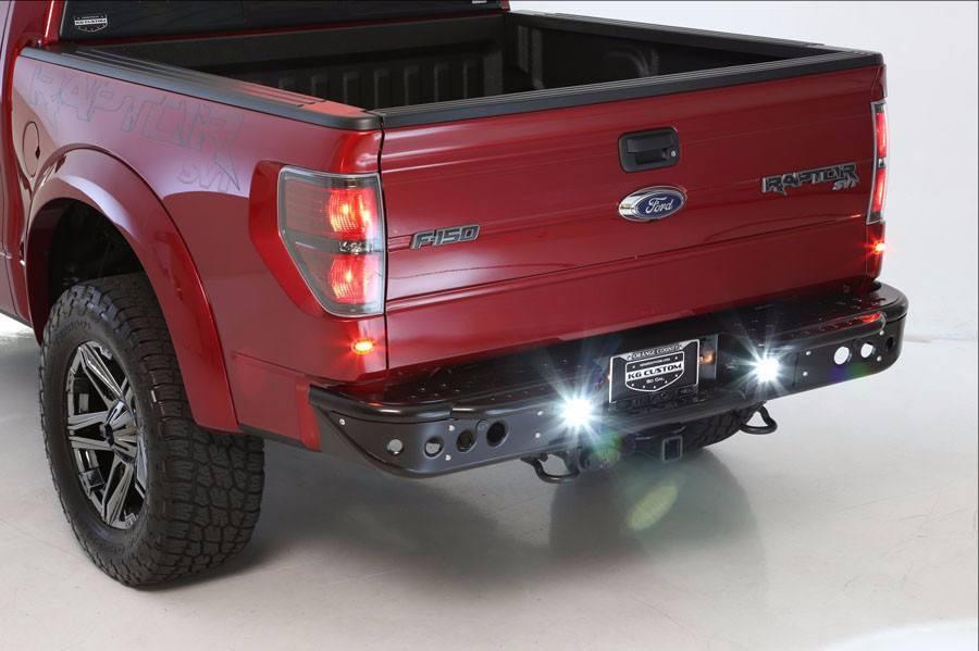 Aftermarket bumper by ADD for 2010–2014 Ford F150 Raptor, rugged back bumper with lighting mounts and sensor compatibility.