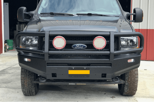 Ford Superduty truck  showcasing  ARB deluxe durable black powder-coated front bumper with grille guard.