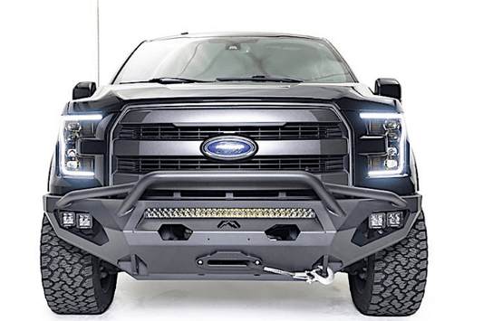 Fab Fours FF15-D3272-1 Aero front bumper with pre-runner guard installed on 2015-2017 Ford F-150, rugged off-road steel bumper with aggressive design and added grille protection