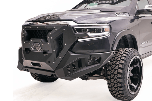 Fab Fours GR4200-1 Grumper front bumper on 2019–2024 Dodge Ram 1500, aggressive full-width design with integrated grille and off-road protection