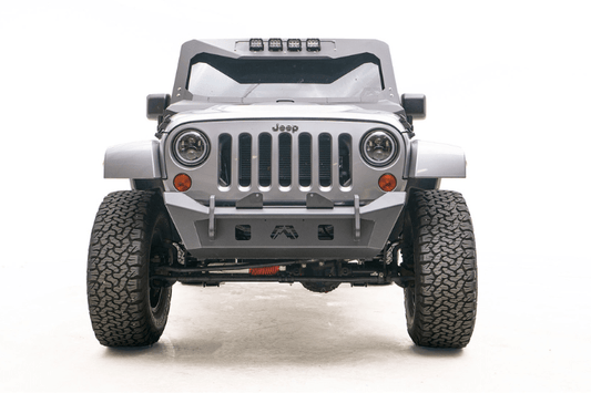Fab Fours JK07-B1951-1 stubby front bumper with no guard on 2007-2018 Jeep Wrangler JK, compact off-road bumper designed for durability, clearance, and winch compatibility