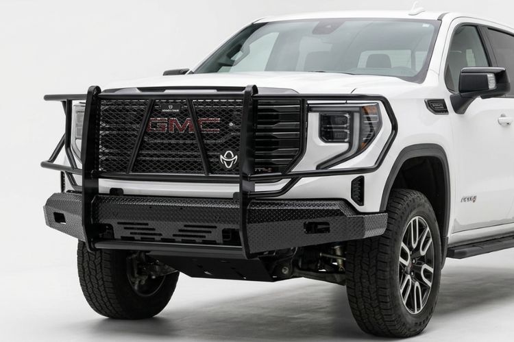 Gloss black Ranch Hand Summit series front bumper with an integrated grille guard template.