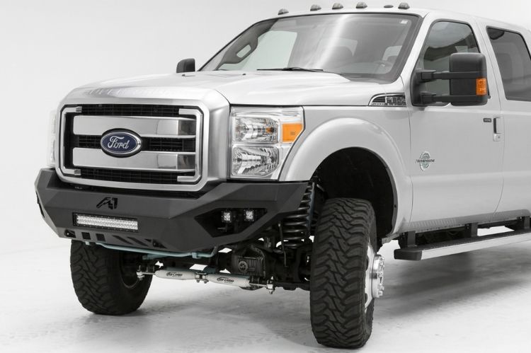 Heavy‑duty truck bumper with no grille guard, front view.