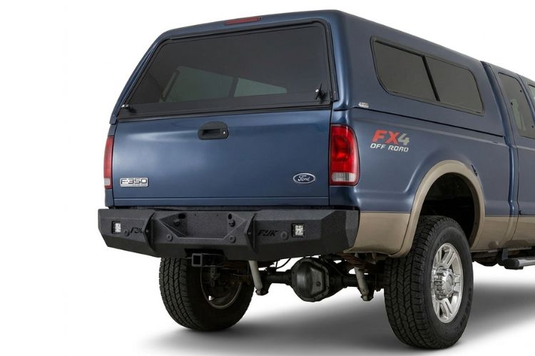 Aftermarket rear bumper for Ford F‑250/F‑350 Super Duty (1998 and newer), heavy‑duty steel design built for durability, towing strength, and rugged off‑road protection.