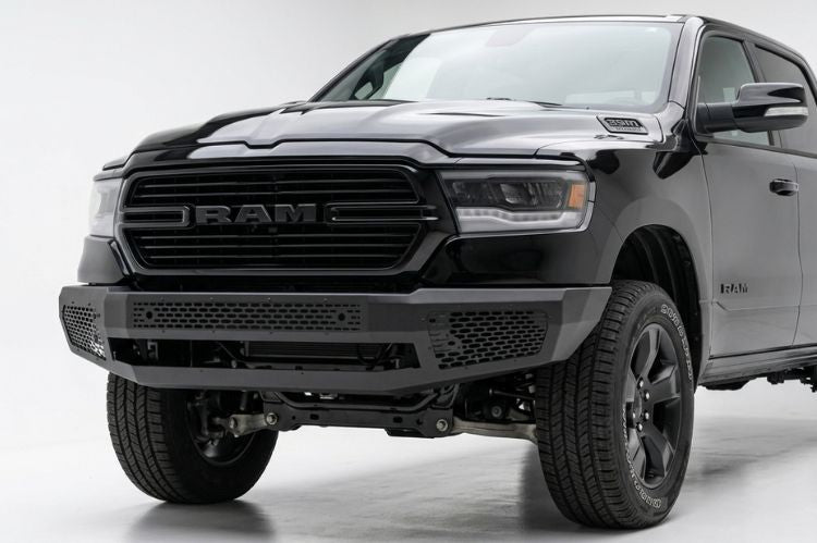 Ranch Hand heavy duty black steel front bumper replacement with full brush guard protection installed on a 2019-2024 Ram 1500 truck.
