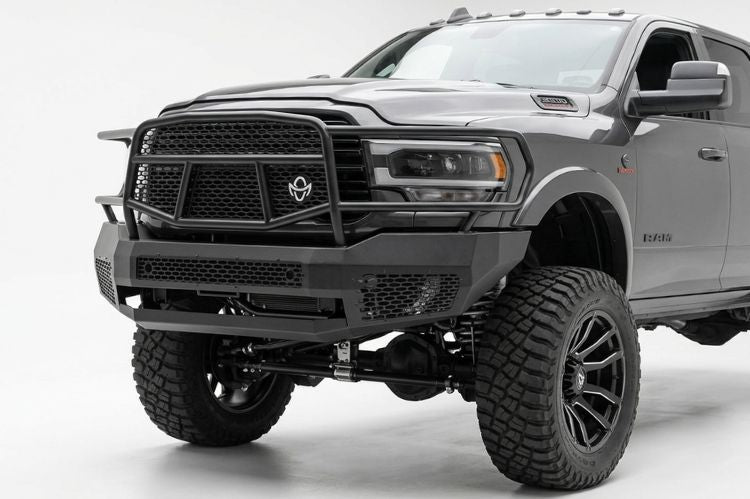 Ranch Hand heavy duty black steel front bumper replacement with full grille guard protection installed on a 2019-2024 Ram 2500 heavy duty truck.