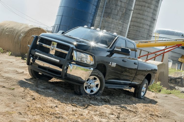 Steel Aries RidgeStep running boards with black finish for Dodge Ram 2500/3500 trucks.