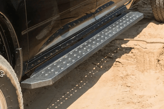 Steel Aries RidgeStep running boards with black finish for Dodge Ram 2500/3500 trucks.