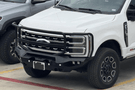 Fab Fours Matrix front bumper designed for Ford Superduty trucks, featuring a heavy-duty full guard for maximum grille and headlight protection, winch-ready compatibility and black powder-coated finish for durability to enhance off-road performance and style.