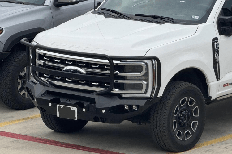 Fab Fours Matrix front bumper designed for Ford Superduty trucks, featuring a heavy-duty full guard for maximum grille and headlight protection, winch-ready compatibility and black powder-coated finish for durability to enhance off-road performance and style.