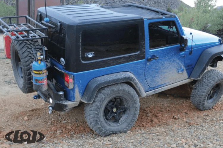 Black textured Power Tank mount by Lod Offroad for trail use