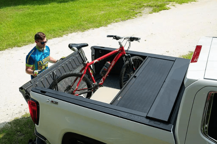 Roll-N-Lock M-Series 1999-2006 GMC Sierra 2500/3500 6.5' Tonneau Cover with Bedrail Caps LG208M