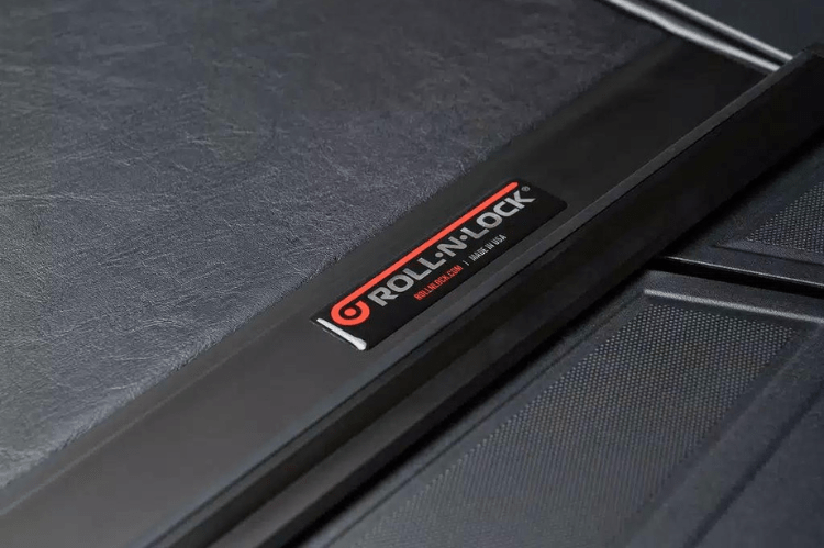 Roll-N-Lock M-Series 1999-2006 GMC Sierra 2500/3500 6.5' Tonneau Cover with Bedrail Caps LG208M