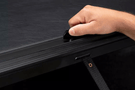 Roll-N-Lock M-Series 1999-2006 GMC Sierra 2500/3500 6.5' Tonneau Cover with Bedrail Caps LG208M