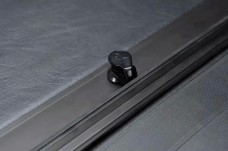 Roll-N-Lock M-Series 1999-2006 GMC Sierra 2500/3500 6.5' Tonneau Cover with Bedrail Caps LG208M