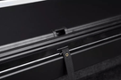 Roll-N-Lock M-Series 1999-2006 GMC Sierra 2500/3500 6.5' Tonneau Cover with Bedrail Caps LG208M