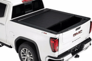 Roll-N-Lock M-Series 1999-2006 GMC Sierra 2500/3500 6.5' Tonneau Cover with Bedrail Caps LG208M