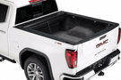 Roll-N-Lock M-Series 1999-2006 GMC Sierra 2500/3500 6.5' Tonneau Cover with Bedrail Caps LG208M
