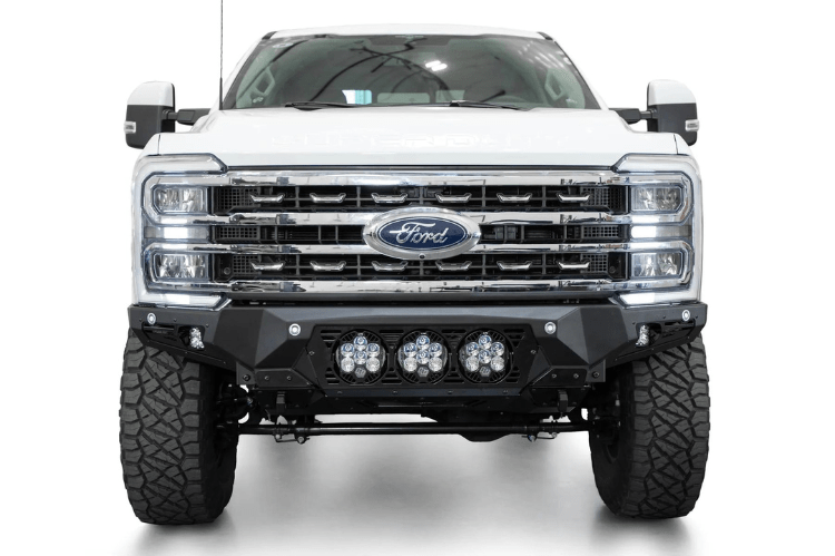 White truck front end showcasing a robust ADD Bomber Black bumper F810014100103, designed for Ford Superduty 2023-2025 models