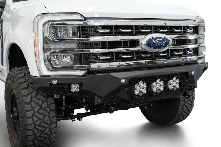 White truck front end showcasing a robust ADD Bomber Black bumper F810014100103, designed for Ford Superduty 2023-2025 models