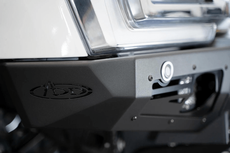 White truck front end showcasing a robust ADD Bomber Black bumper F810014100103, designed for Ford Superduty 2023-2025 models