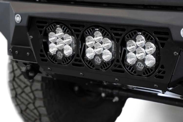 White truck front end showcasing a robust ADD Bomber Black bumper F810014100103, designed for Ford Superduty 2023-2025 models