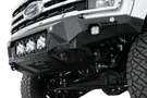 White truck front end showcasing a robust ADD Bomber Black bumper F810014100103, designed for Ford Superduty 2023-2025 models