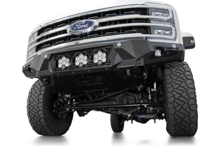 White truck front end showcasing a robust ADD Bomber Black bumper F810014100103, designed for Ford Superduty 2023-2025 models