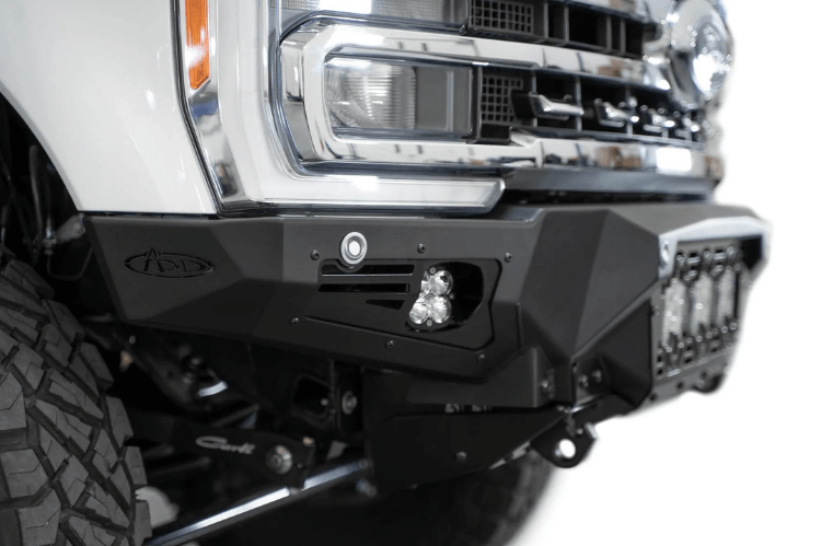 White truck front end showcasing a robust ADD Bomber Black bumper F810014100103, designed for Ford Superduty 2023-2025 models
