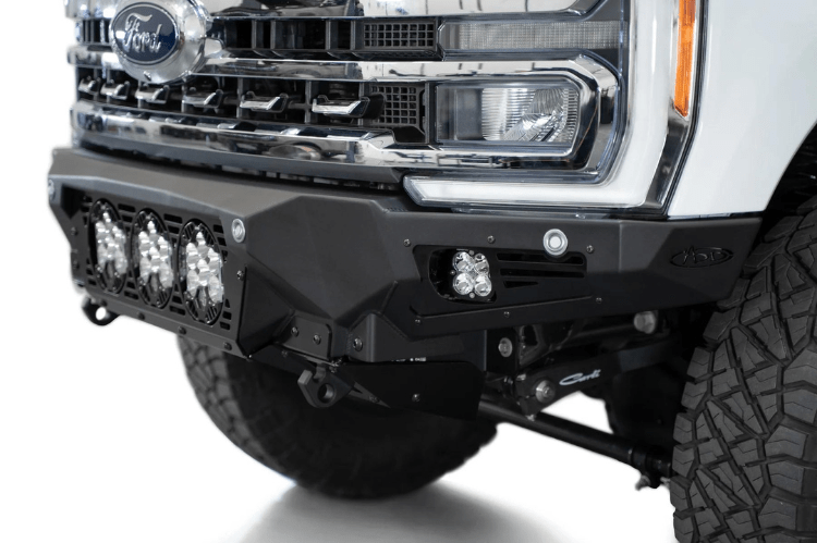 White truck front end showcasing a robust ADD Bomber Black bumper F810014100103, designed for Ford Superduty 2023-2025 models