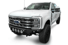 White truck's front end showcasing ADD Bomber Black bumper F810014110103, compatible with Ford Superduty models 2023-2025