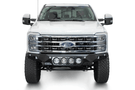 White truck's front end showcasing ADD Bomber Black bumper F810014110103, compatible with Ford Superduty models 2023-2025