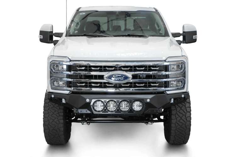 White truck's front end showcasing ADD Bomber Black bumper F810014110103, compatible with Ford Superduty models 2023-2025